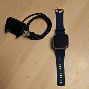 Smartwatch with Blue Strap and Gold Accents